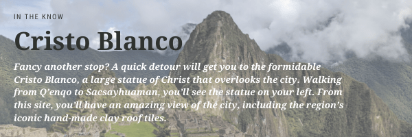Text: Fancy another stop? A quick detour will get you to the formidable Cristo Blanco, a large statue of Christ that overlooks the city. Walking from Q'enqo to Sacsayhuaman, you'll see the statue on your left. From this site, you'll have an amazing view of the city, including the region's iconic hand-made clay roof tiles.