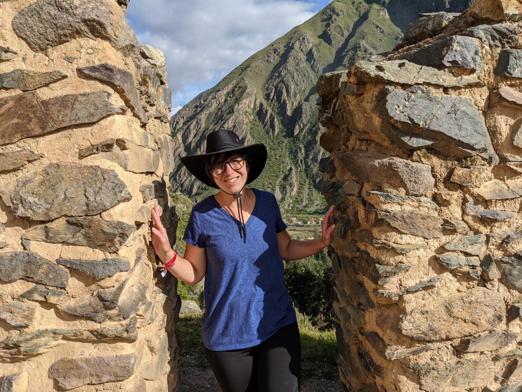 I stand between the ruined walls of an ancient house