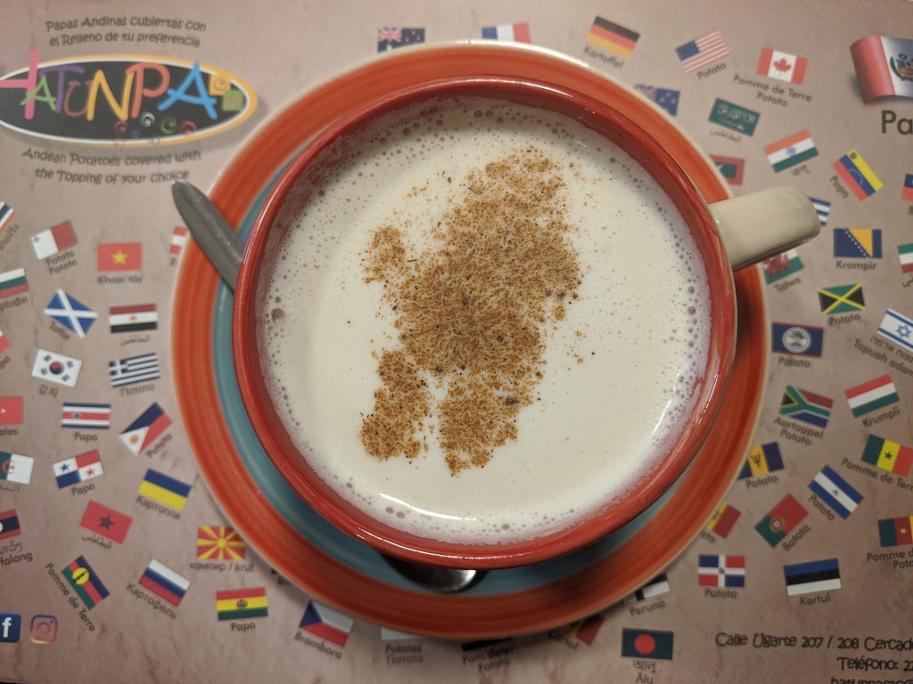 Above shot of a frothy warm drink, Diana, in a colorful mug